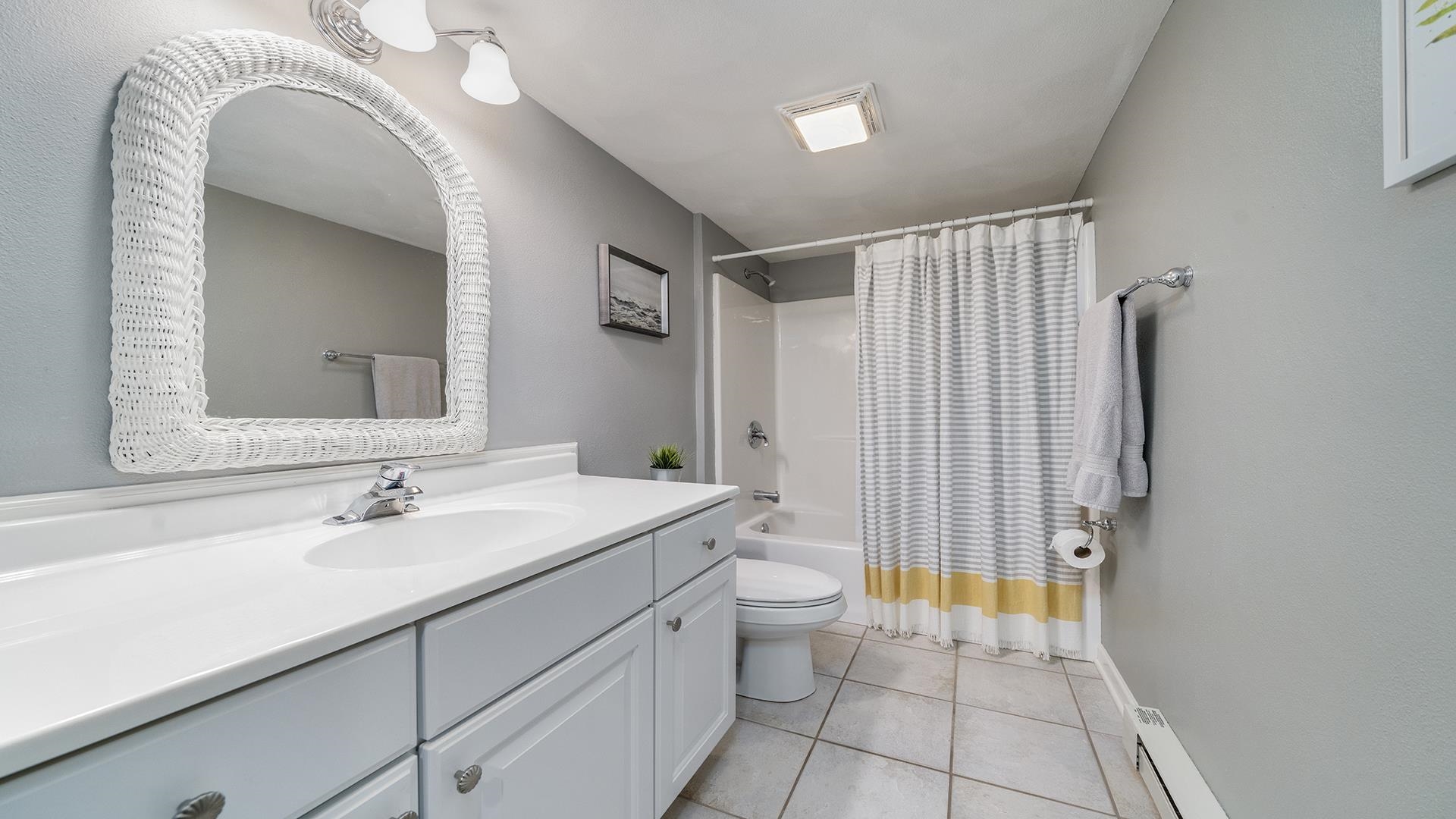 7676 Forest Way Roscoe, IL 61073 - Photo 44 of 56 a bathroom with a sink a toilet and shower