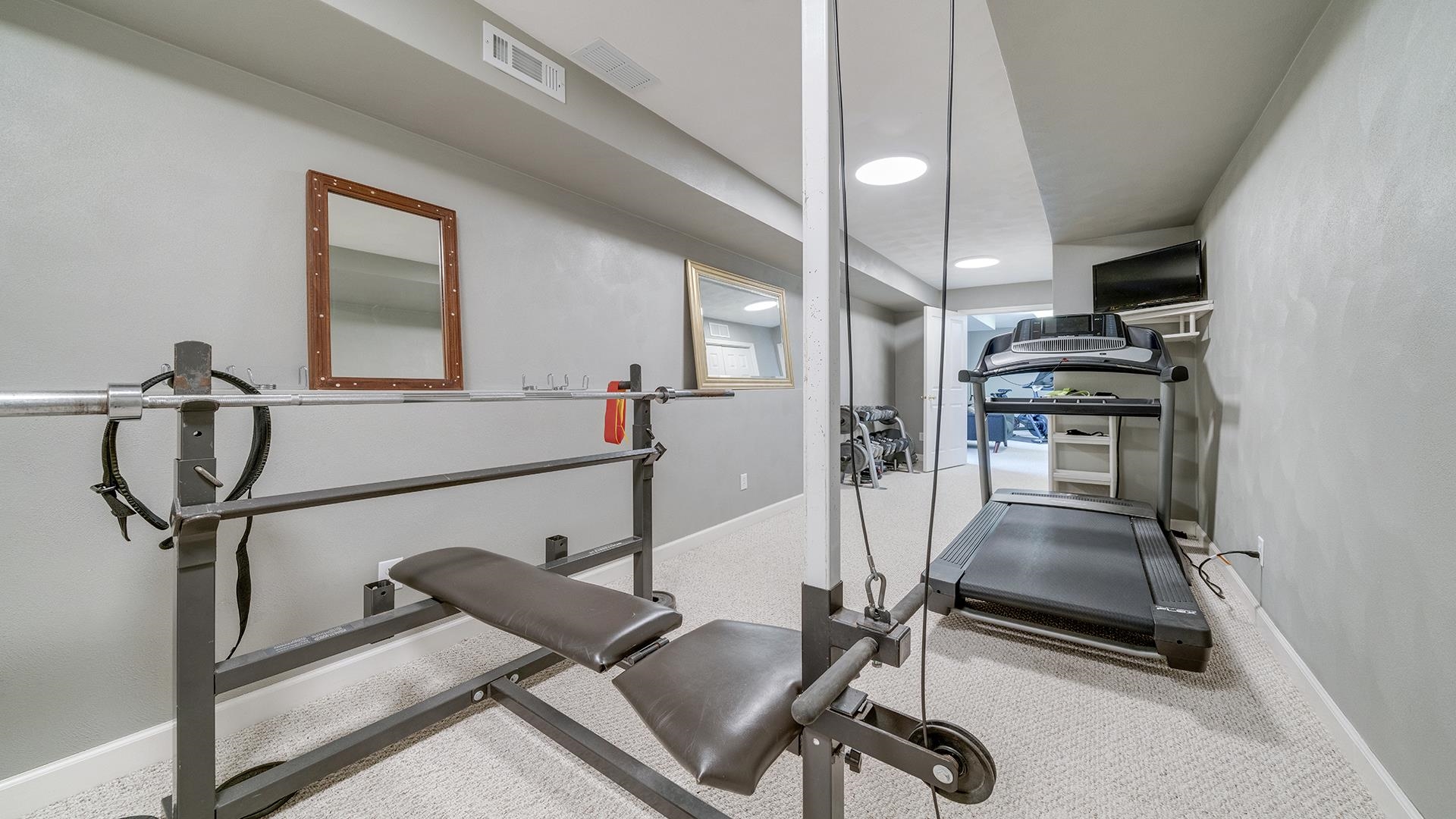 7676 Forest Way Roscoe, IL 61073 - Photo 45 of 56 a view of a room with gym equipment