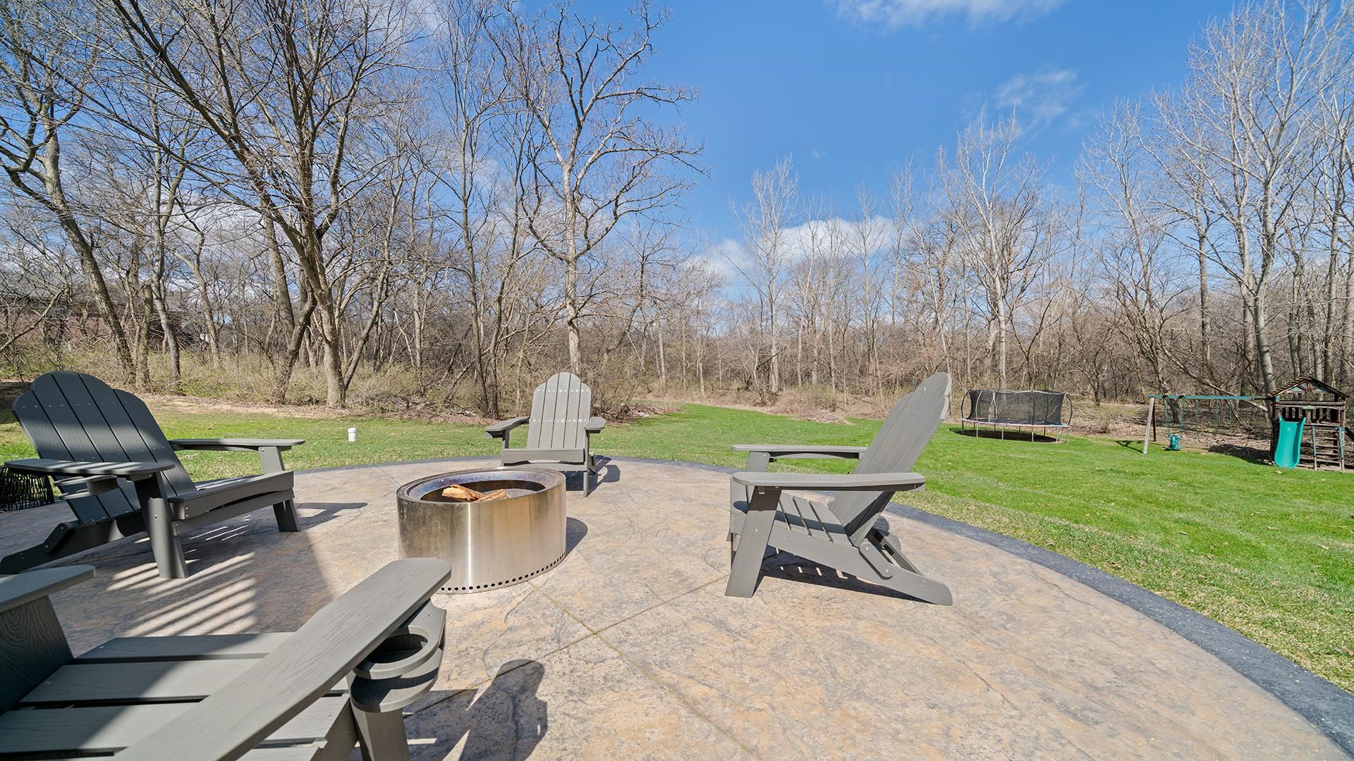 7676 Forest Way Roscoe, IL 61073 - Photo 50 of 56 a view of a bench in a garden