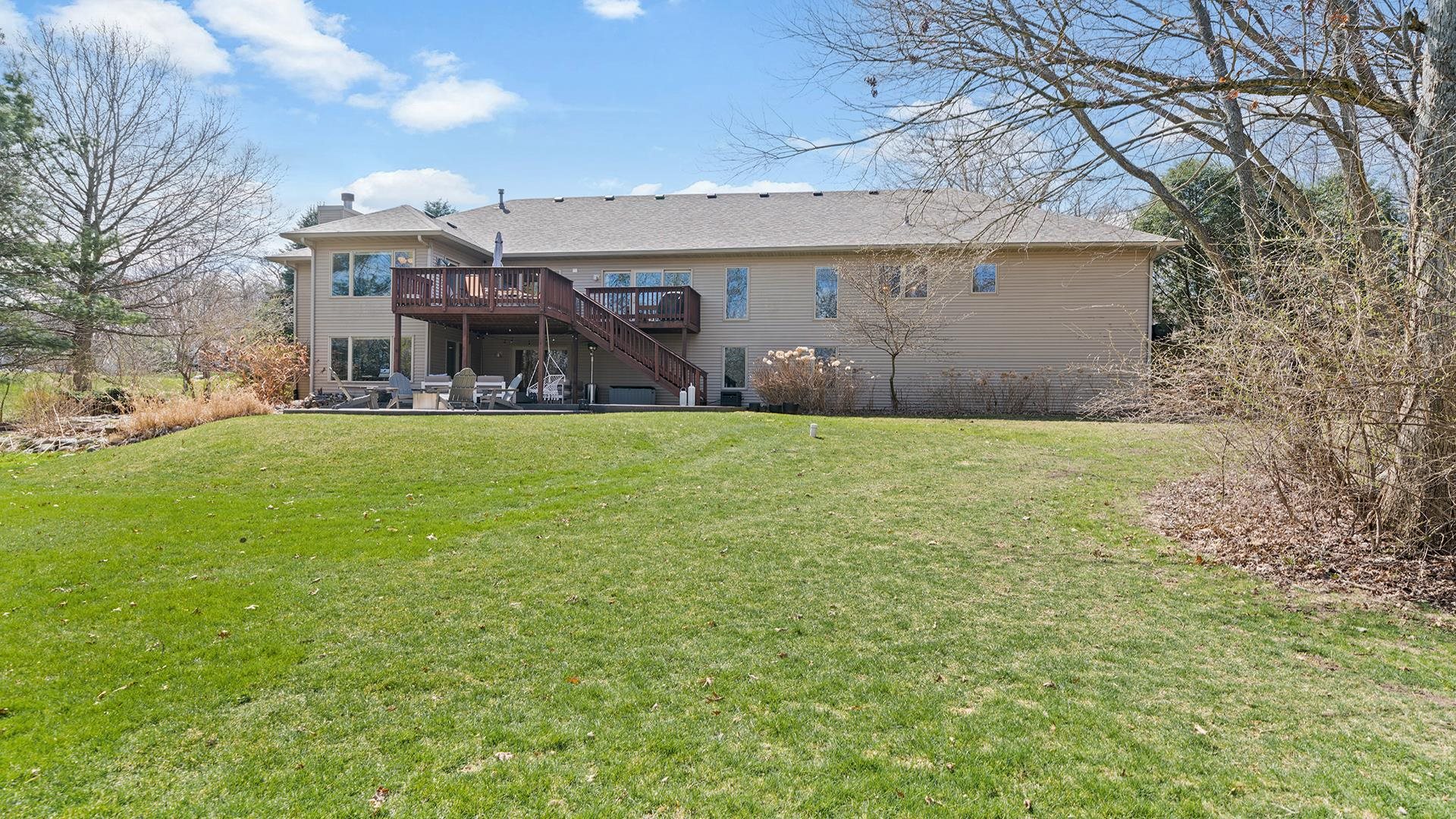 7676 Forest Way Roscoe, IL 61073 - Photo 53 of 56 a view of a house with a yard and sitting area