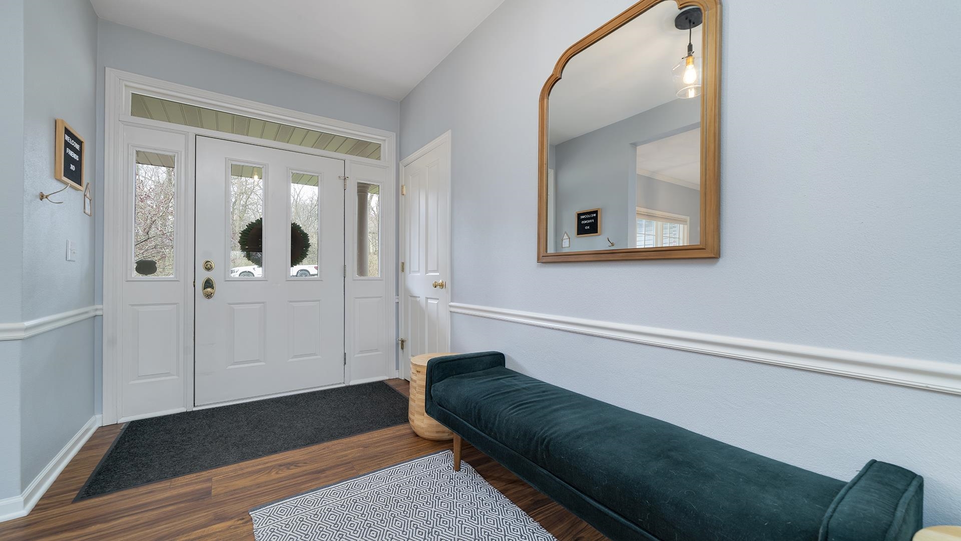 7676 Forest Way Roscoe, IL 61073 - Photo 6 of 56 a living room with furniture and a window