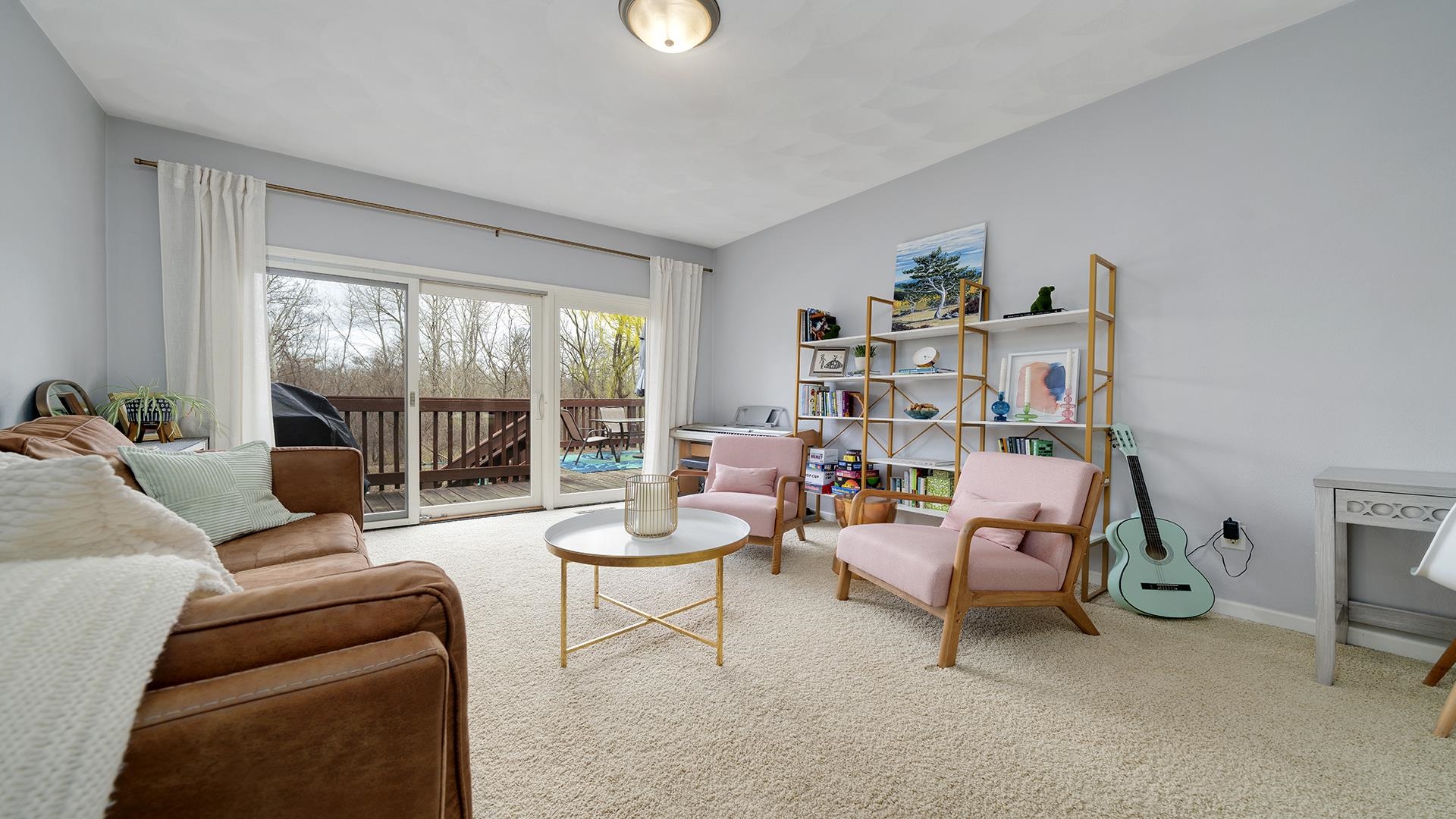 7676 Forest Way Roscoe, IL 61073 - Photo 10 of 56 a living room with furniture and a large window
