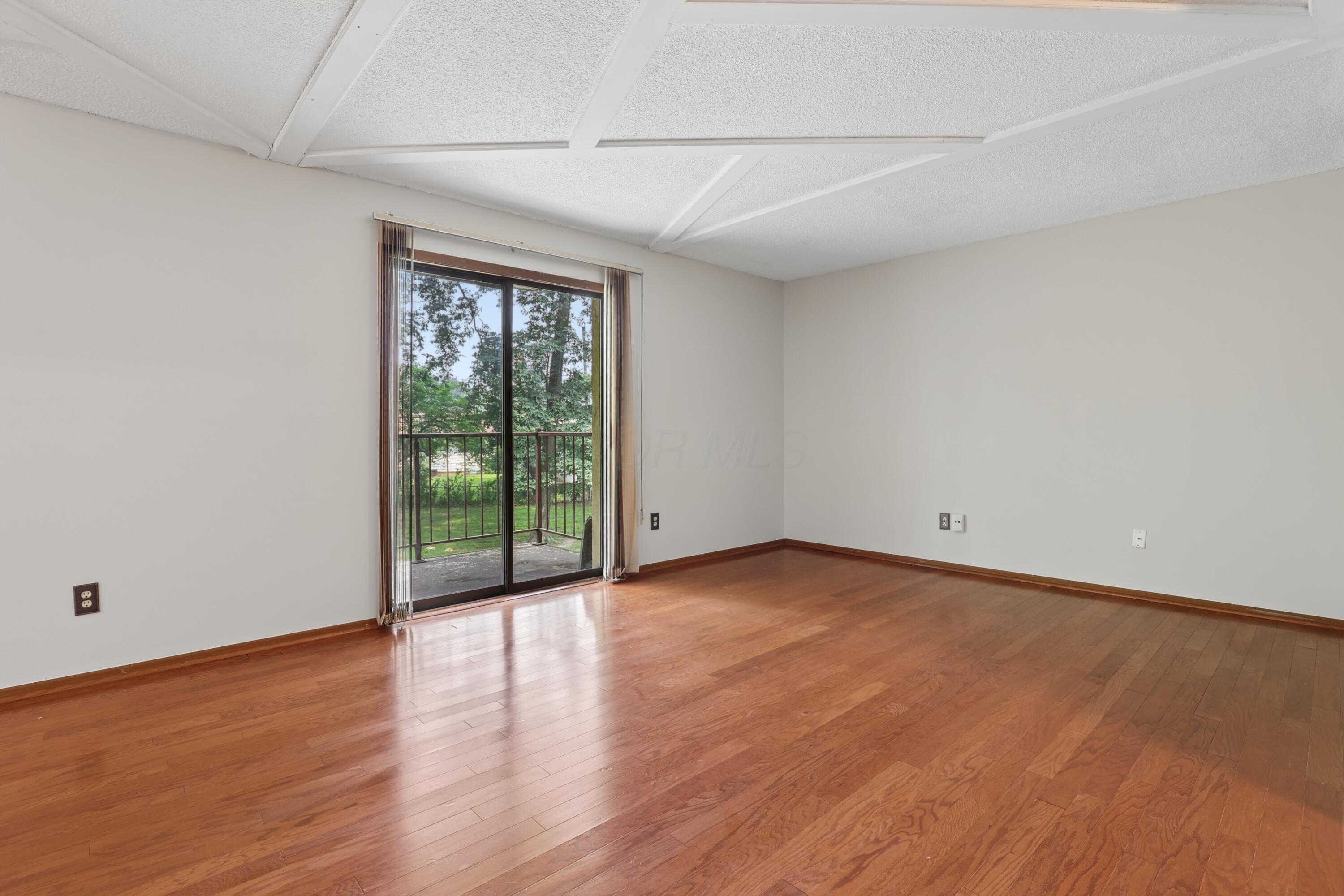 4145 Karl Road, Unit 228 Columbus, OH 43224 - Photo 12 of 29 Living room with Balcony