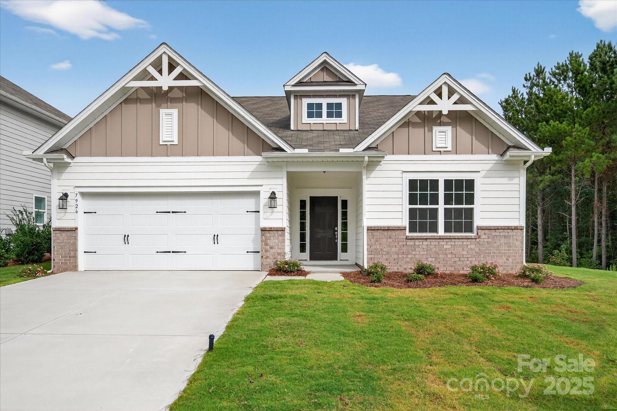7926 Rolling Wheels Road, Unit KEN0008 Charlotte, NC 28215 - Photo 1 of 47 a front view of a house with a yard