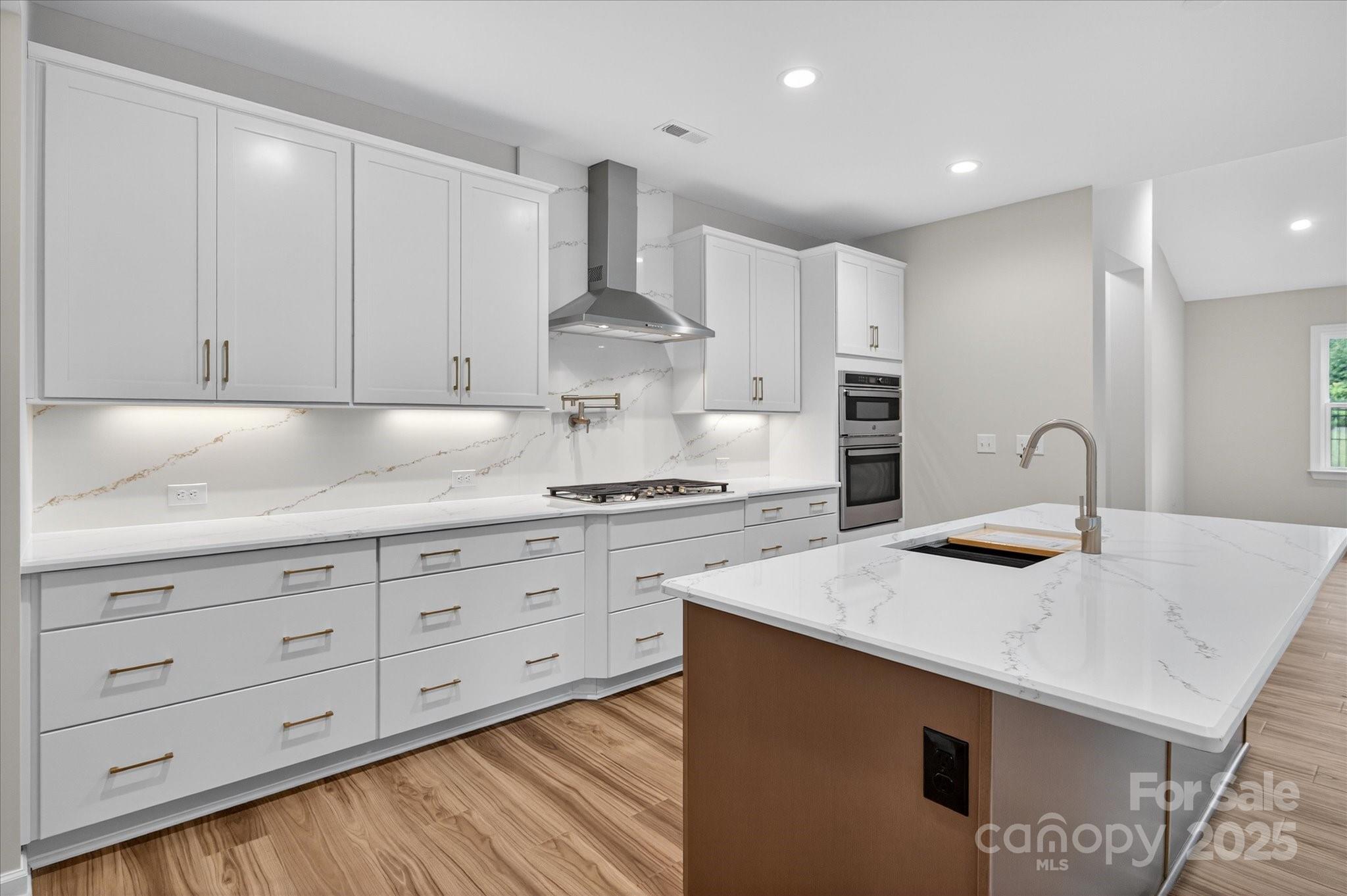 7926 Rolling Wheels Road, Unit KEN0008 Charlotte, NC 28215 - Photo 11 of 47 a kitchen with granite countertop white cabinets and white appliances