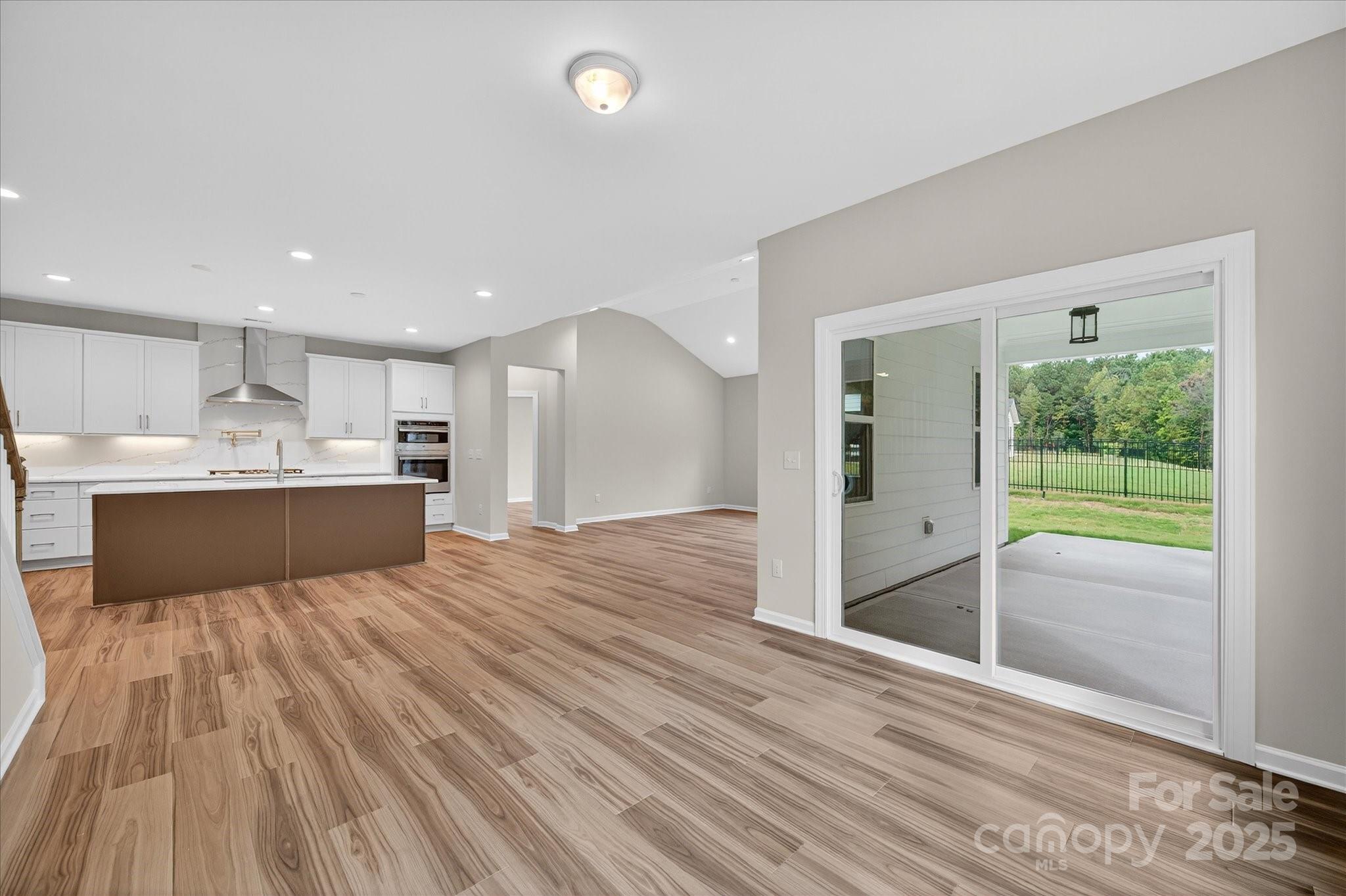 7926 Rolling Wheels Road, Unit KEN0008 Charlotte, NC 28215 - Photo 16 of 47 a view of kitchen with wooden floor and a sink