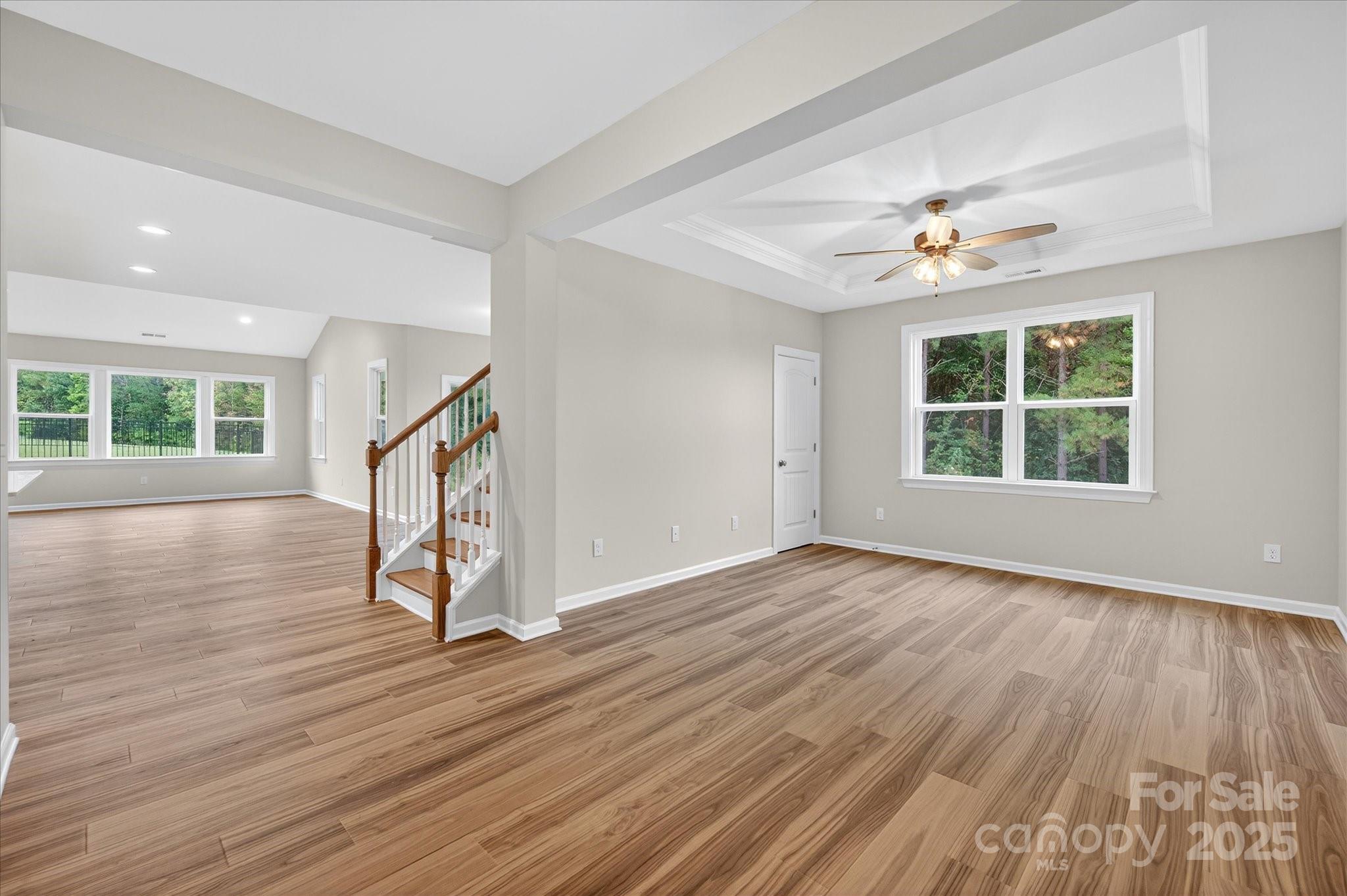 7926 Rolling Wheels Road, Unit KEN0008 Charlotte, NC 28215 - Photo 21 of 47 wooden floor in an empty room with a window