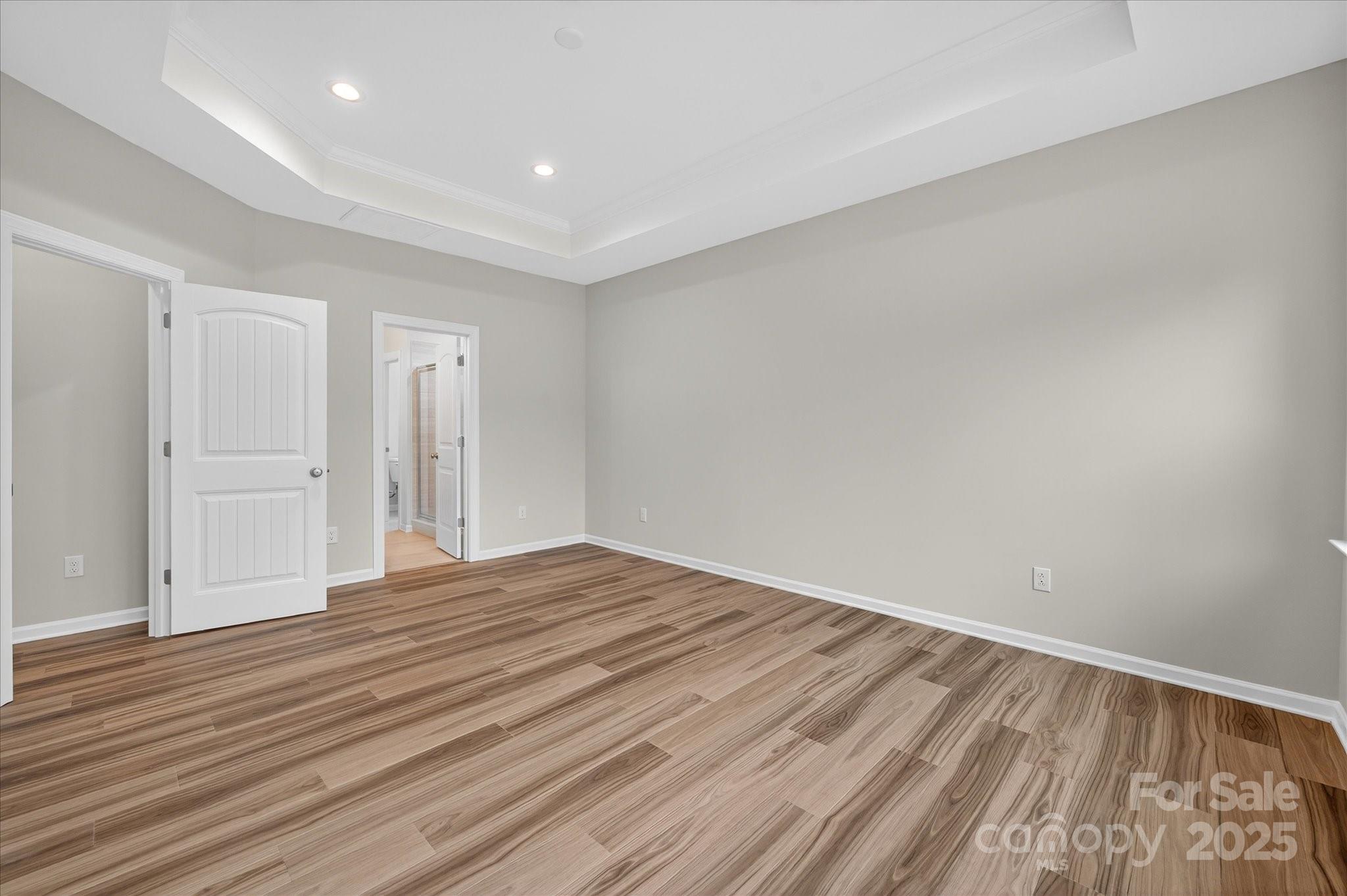 7926 Rolling Wheels Road, Unit KEN0008 Charlotte, NC 28215 - Photo 25 of 47 a view of empty room with wooden floor