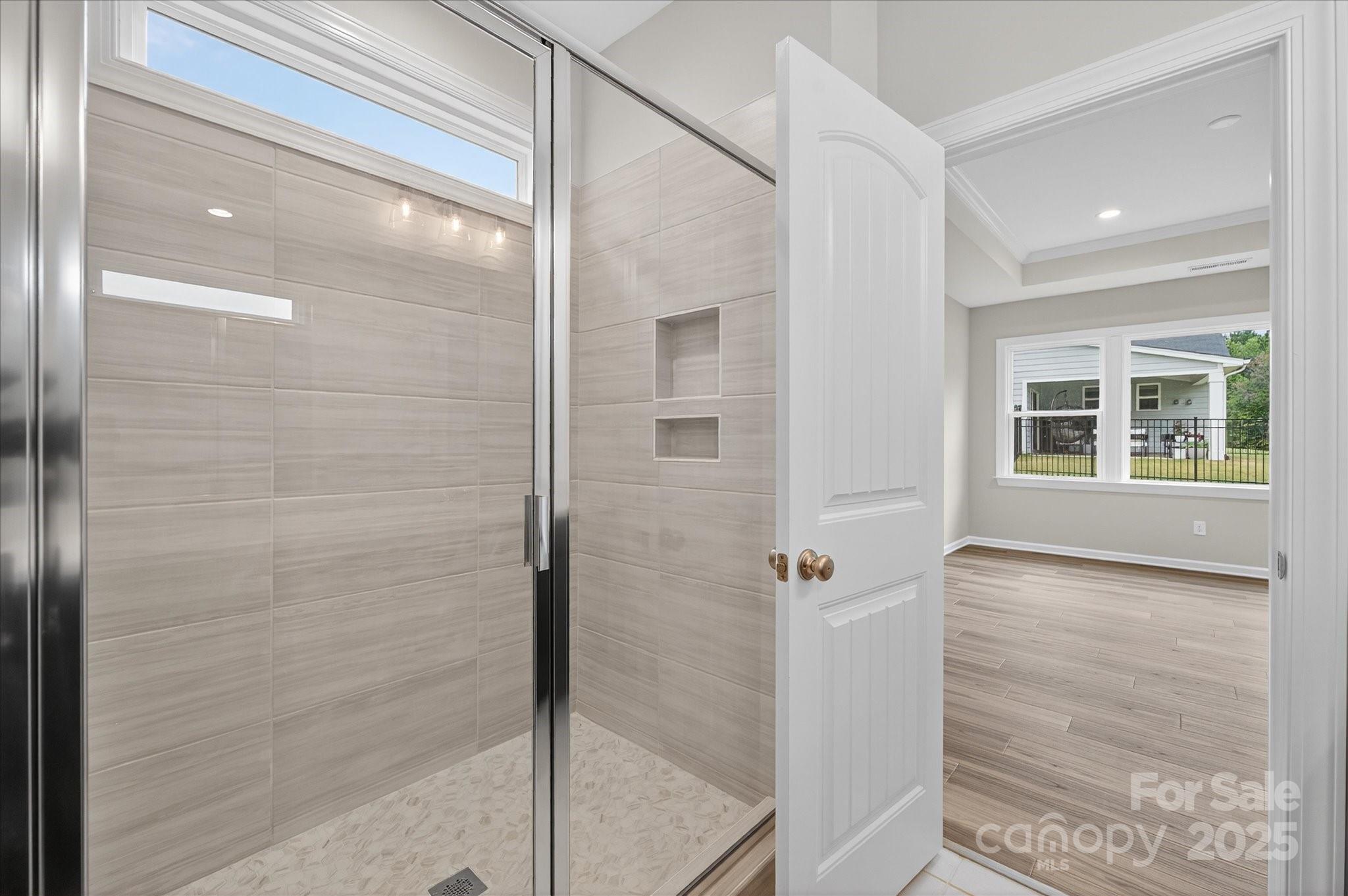 7926 Rolling Wheels Road, Unit KEN0008 Charlotte, NC 28215 - Photo 30 of 47 a bathroom with a shower