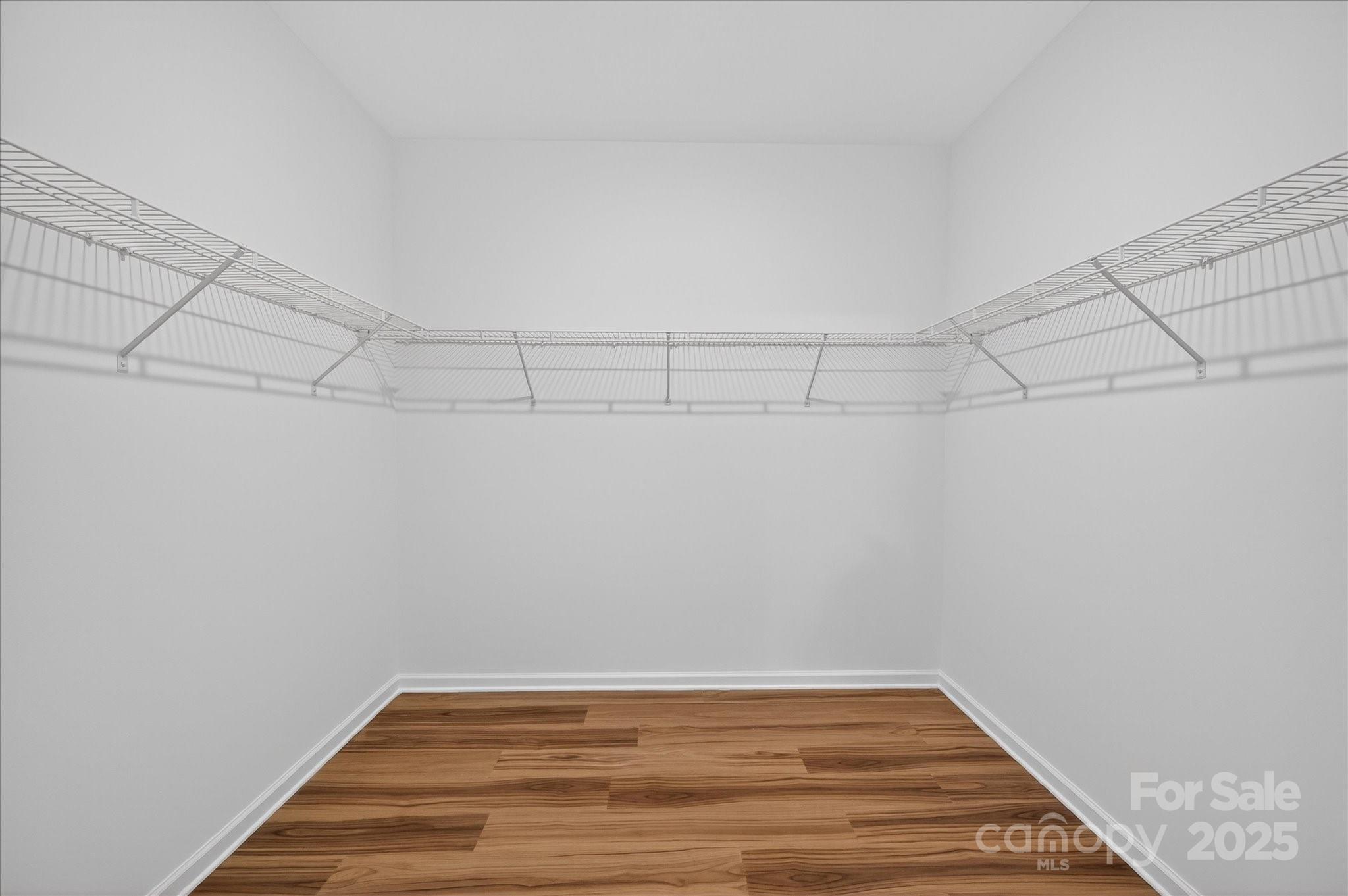 7926 Rolling Wheels Road, Unit KEN0008 Charlotte, NC 28215 - Photo 31 of 47 a view of a room with racks on the wall