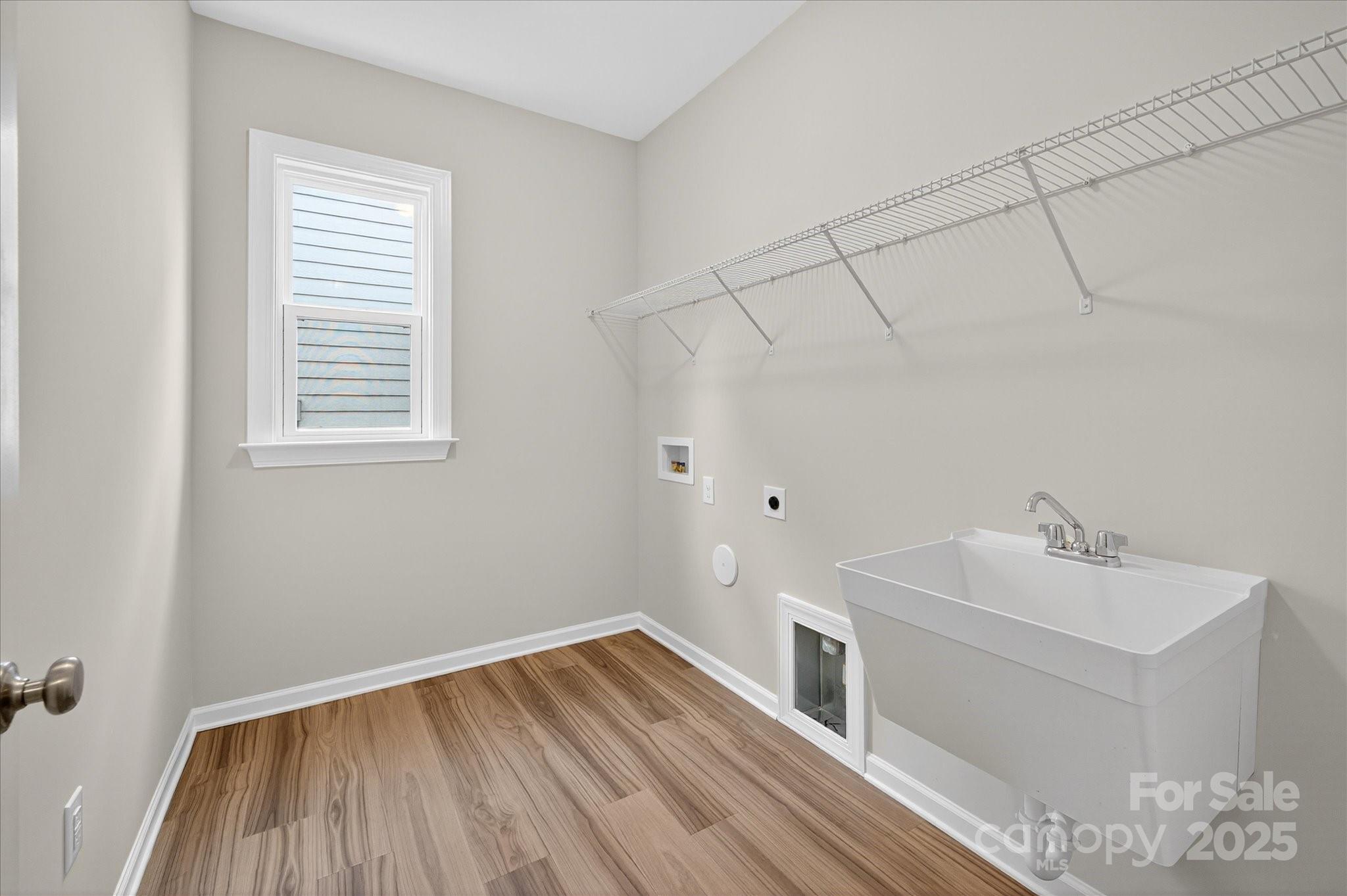 7926 Rolling Wheels Road, Unit KEN0008 Charlotte, NC 28215 - Photo 36 of 47 a bathroom with a sink and mirror