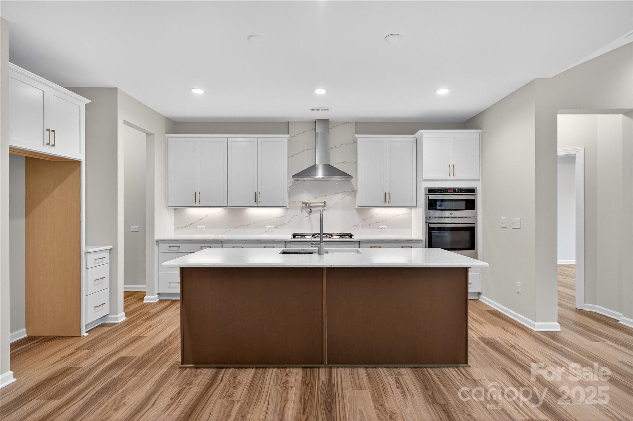 7926 Rolling Wheels Road, Unit KEN0008 Charlotte, NC 28215 - Photo 7 of 47 a kitchen with stainless steel appliances granite countertop a sink stove and refrigerator