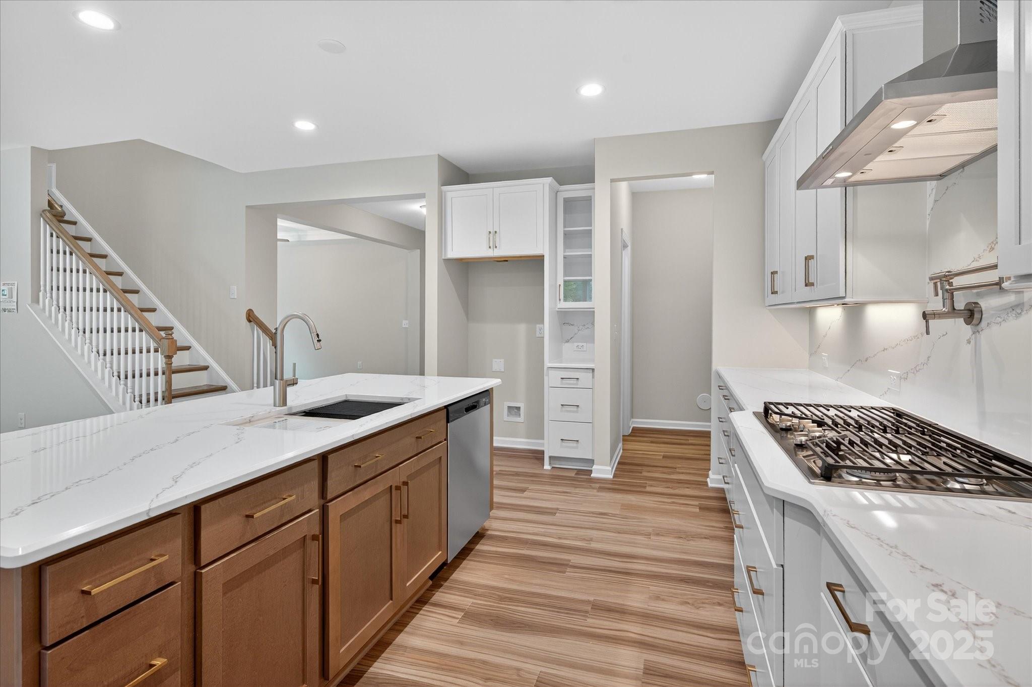 7926 Rolling Wheels Road, Unit KEN0008 Charlotte, NC 28215 - Photo 10 of 47 a kitchen with a sink stove and refrigerator