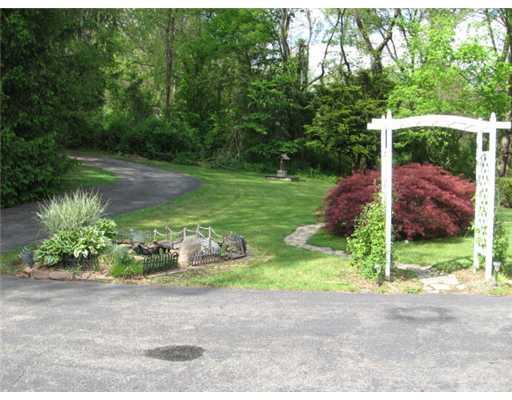 26 Gearing Road Monongahela, PA 15063 - Photo 2 of 18 Exterior Front. Lovely landscaping, including a fish pond.