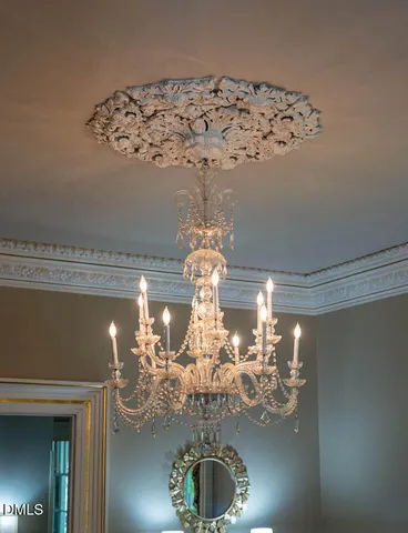 a bedroom with bed and wooden floor