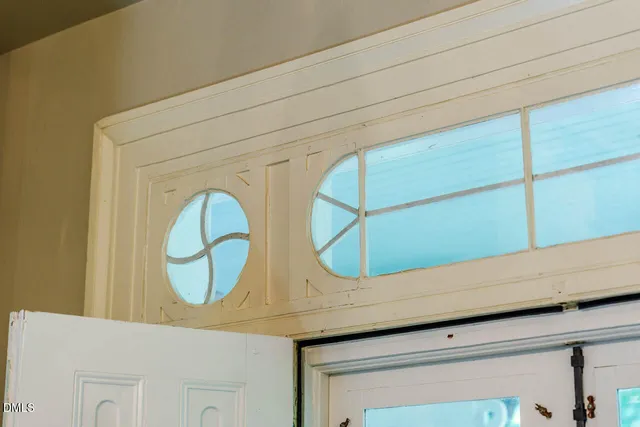 a bathroom with a glass shower door