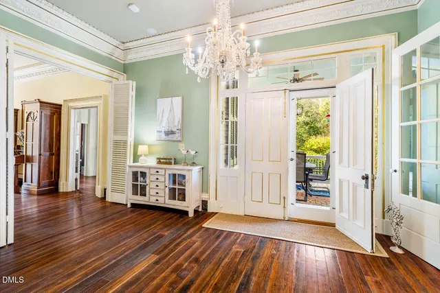 a bedroom with a bed lamps and fireplace