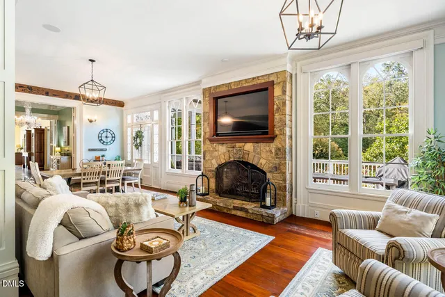 a view of a porch with wooden floor and windows