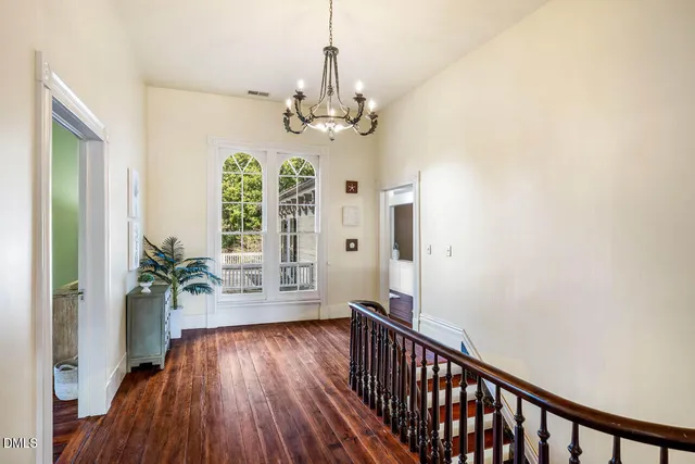 a bedroom with a bed and a table in it