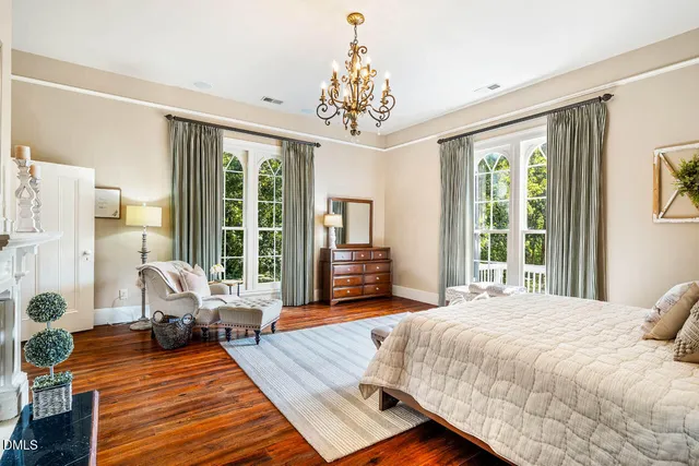 a bathroom with a granite countertop toilet a sink and a mirror