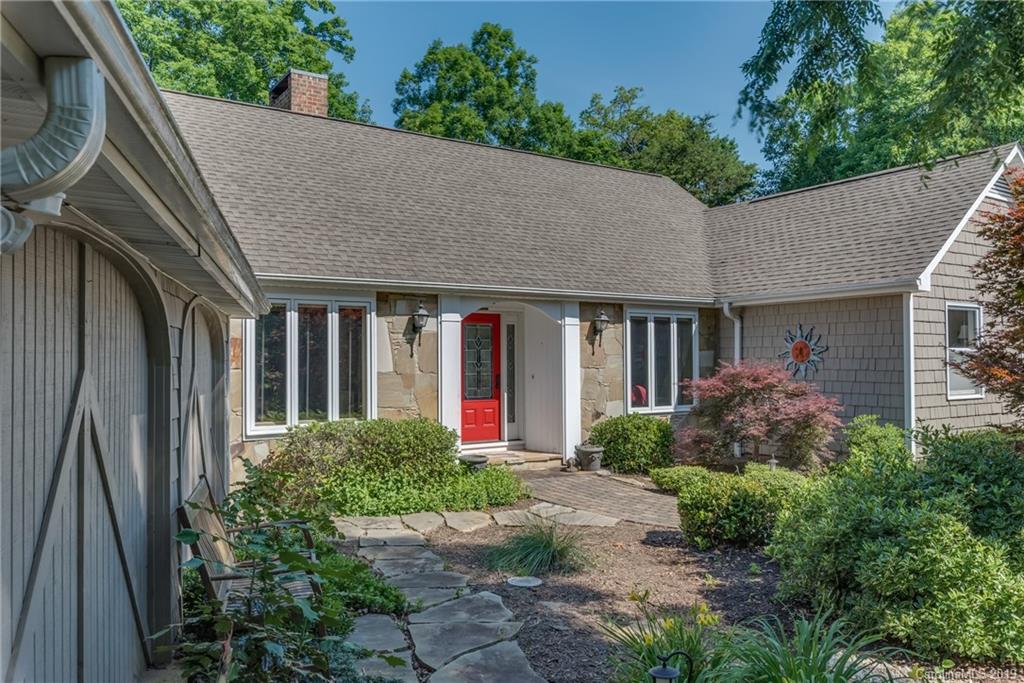 1790 Red Fox Road Tryon, NC 28782 - Photo 1 of 40 a front view of a house with garden