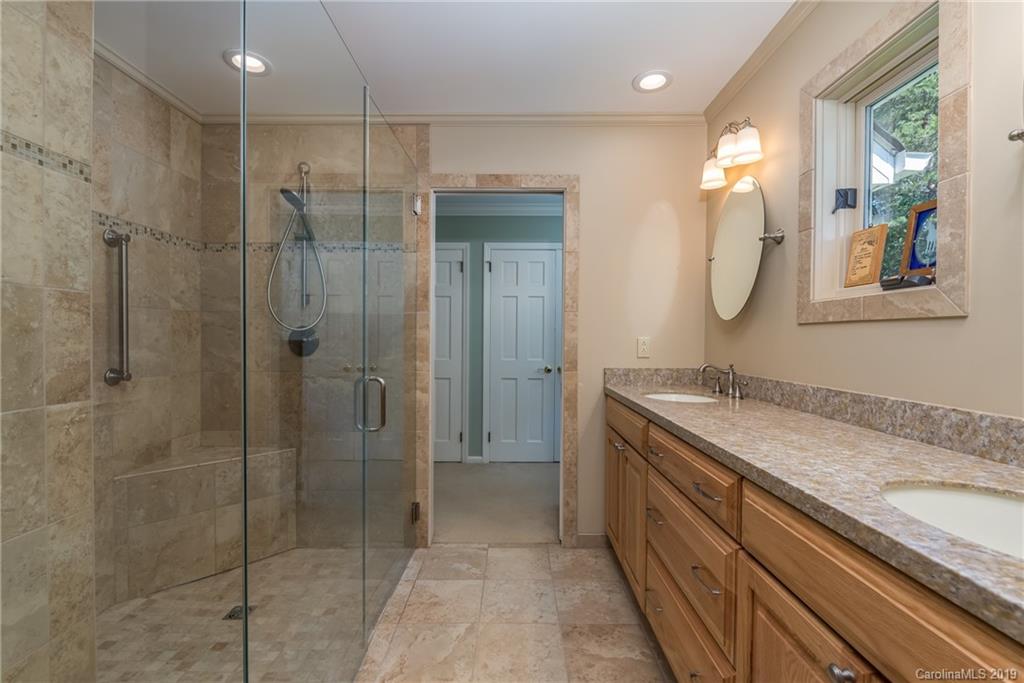 1790 Red Fox Road Tryon, NC 28782 - Photo 12 of 40 a bathroom with a granite countertop sink mirror and double