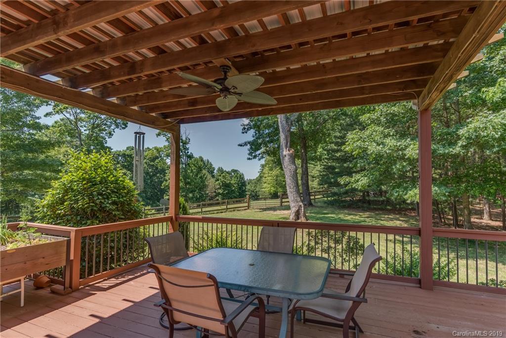 1790 Red Fox Road Tryon, NC 28782 - Photo 14 of 40 a view of a chair and table in the balcony