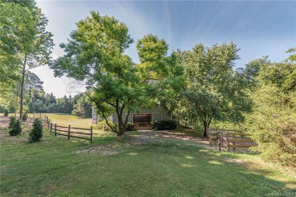 1790 Red Fox Road Tryon, NC 28782 - Photo 16 of 40 a view of a house with a yard