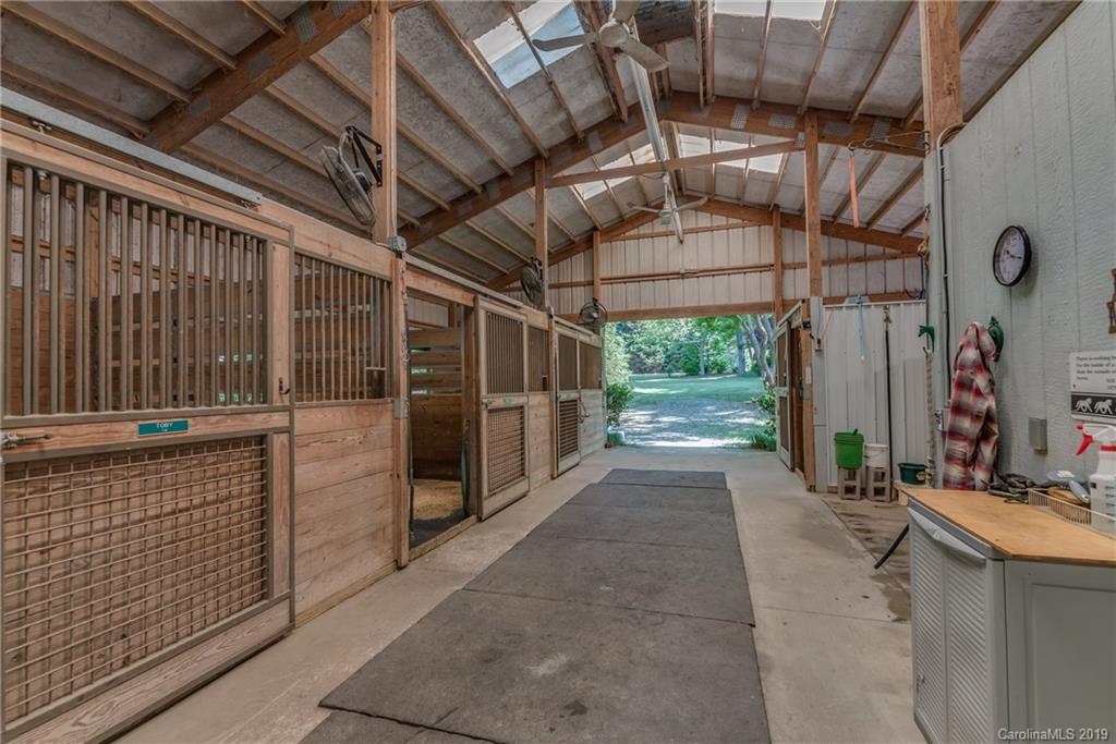 1790 Red Fox Road Tryon, NC 28782 - Photo 19 of 40 a view of a garage with wooden wall