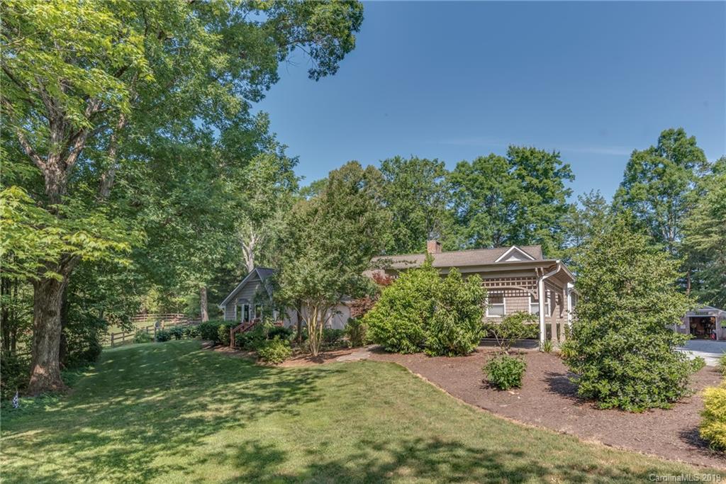1790 Red Fox Road Tryon, NC 28782 - Photo 30 of 40 a front view of a house with a yard