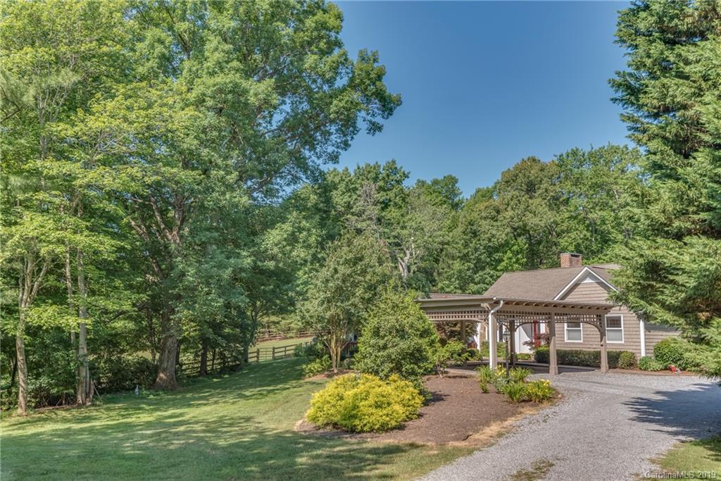 1790 Red Fox Road Tryon, NC 28782 - Photo 31 of 40 a front view of a house with a garden