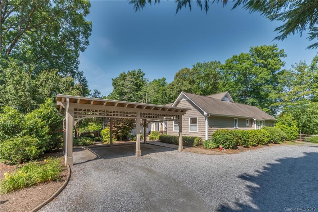 1790 Red Fox Road Tryon, NC 28782 - Photo 33 of 40 a view of a house with a yard and potted plants