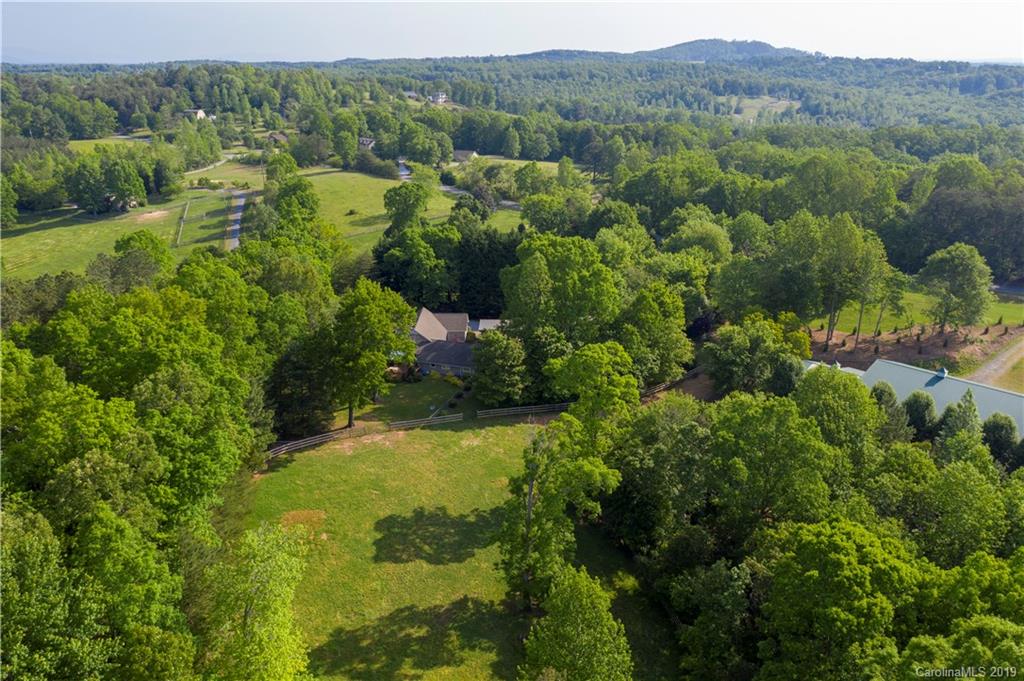 1790 Red Fox Road Tryon, NC 28782 - Photo 39 of 40 a view of a lush green forest with trees and some houses