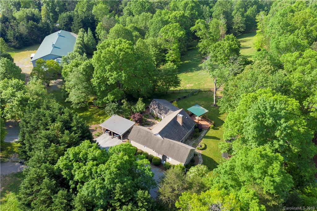 1790 Red Fox Road Tryon, NC 28782 - Photo 40 of 40 an aerial view of a house with a yard and lake view