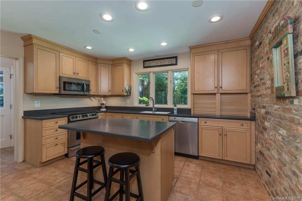 1790 Red Fox Road Tryon, NC 28782 - Photo 6 of 40 a kitchen with sink cabinets and microwave