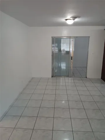 a view of an empty room and window in a room