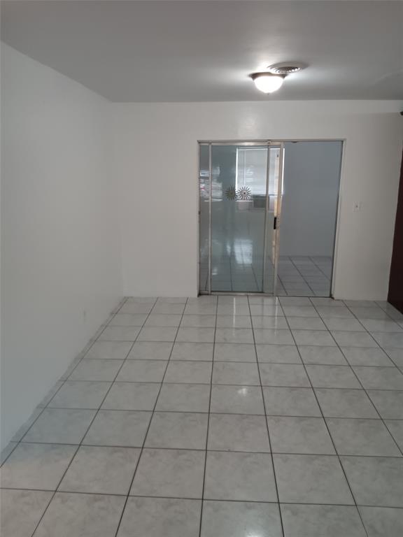 120 Northeast 26th Court Pompano Beach, FL 33064 - Photo 11 of 33 a view of an empty room and window