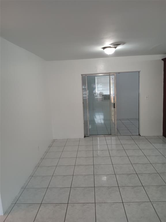 120 Northeast 26th Court Pompano Beach, FL 33064 - Photo 12 of 33 a view of an empty room and window in a room