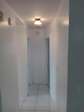 a view of bathroom with a mirror