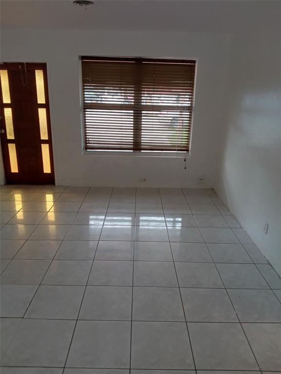 120 Northeast 26th Court Pompano Beach, FL 33064 - Photo 22 of 33 a view of an empty room with a window