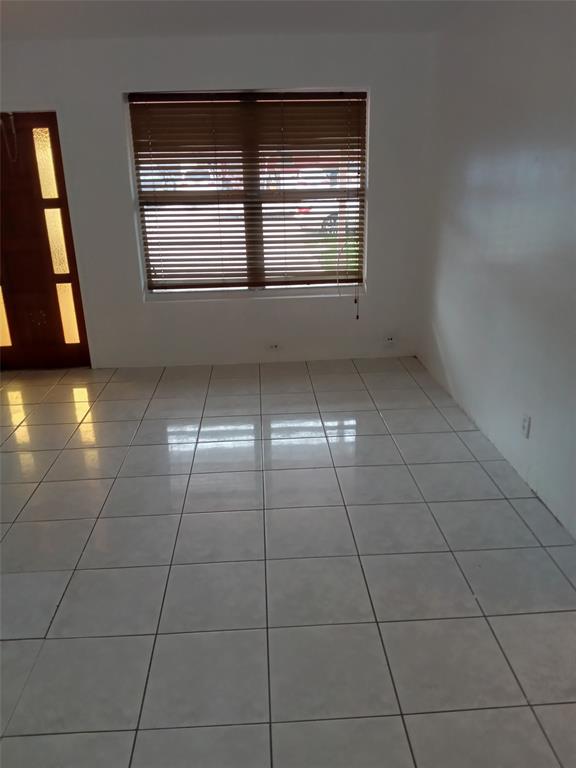 120 Northeast 26th Court Pompano Beach, FL 33064 - Photo 23 of 33 a view of an empty room with a window