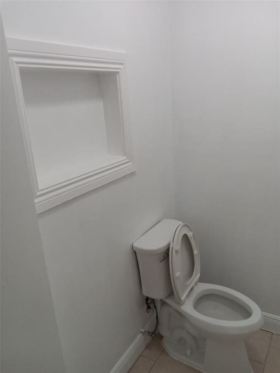 120 Northeast 26th Court Pompano Beach, FL 33064 - Photo 24 of 33 a bathroom with a toilet and a sink