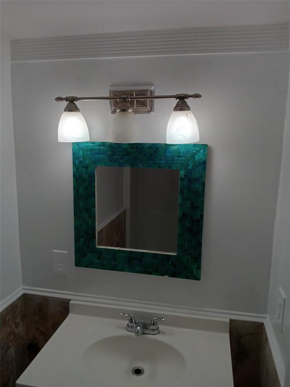 120 Northeast 26th Court Pompano Beach, FL 33064 - Photo 26 of 33 a bathroom with a sink and a mirror