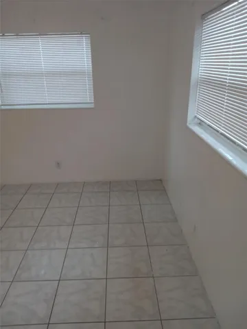 a view of a room that has a window in it