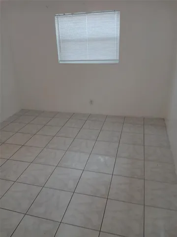 a view of a room that has dryer and window