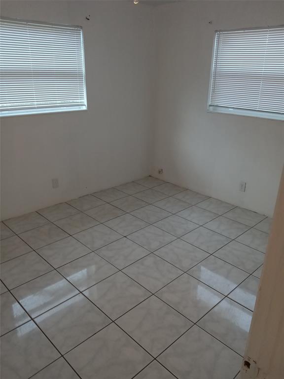 120 Northeast 26th Court Pompano Beach, FL 33064 - Photo 9 of 33 a view of a room that has dryer and window