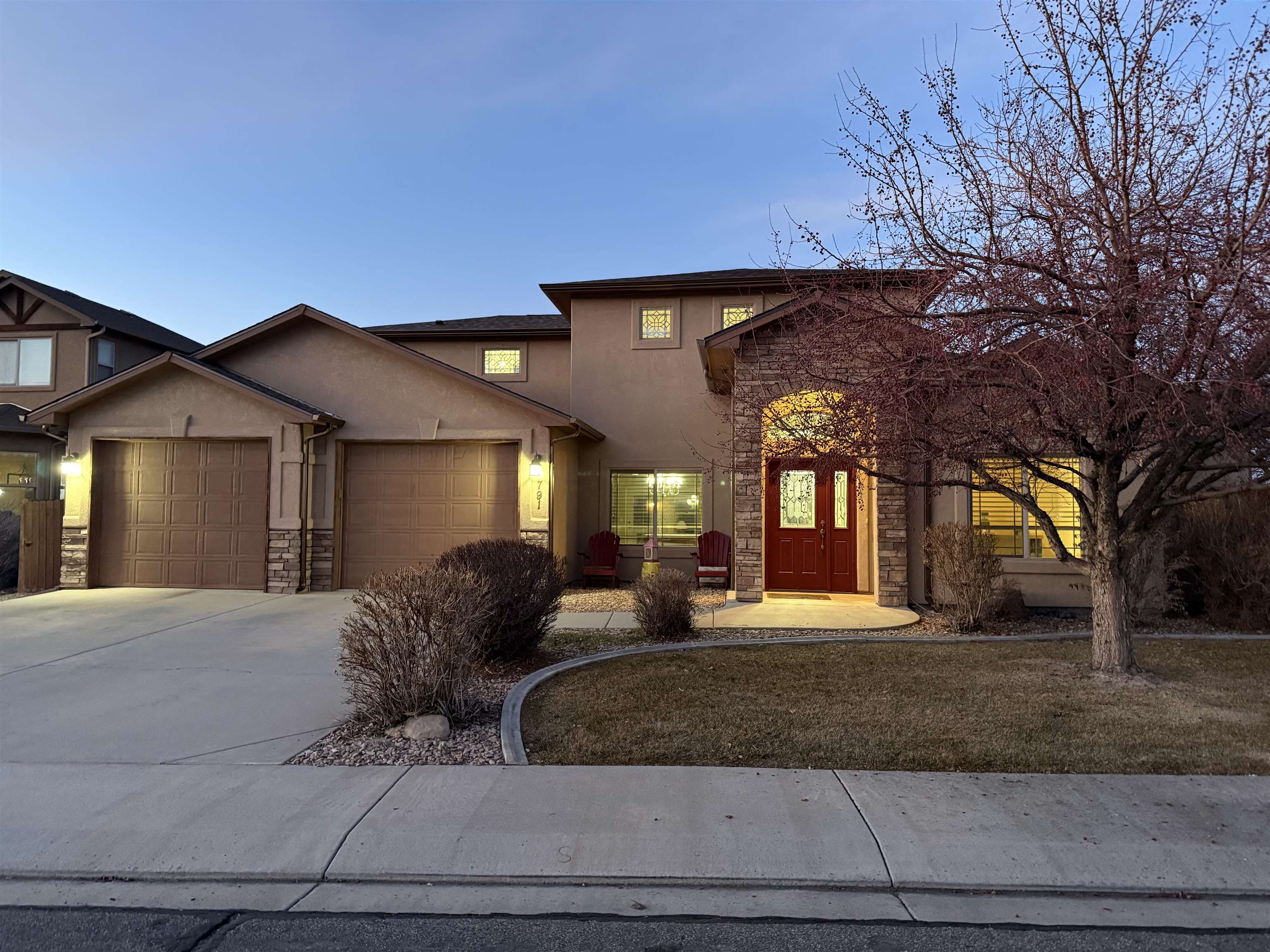 791 Yew Street Fruita, CO 81521 - Photo 1 of 33 a view of a house with a large tree