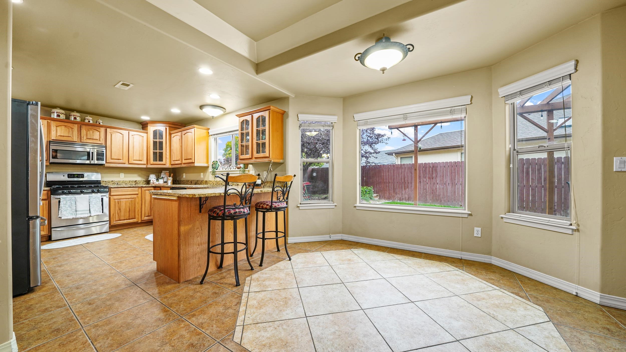 791 Yew Street Fruita, CO 81521 - Photo 11 of 33 a view of a kitchen with furniture and windows