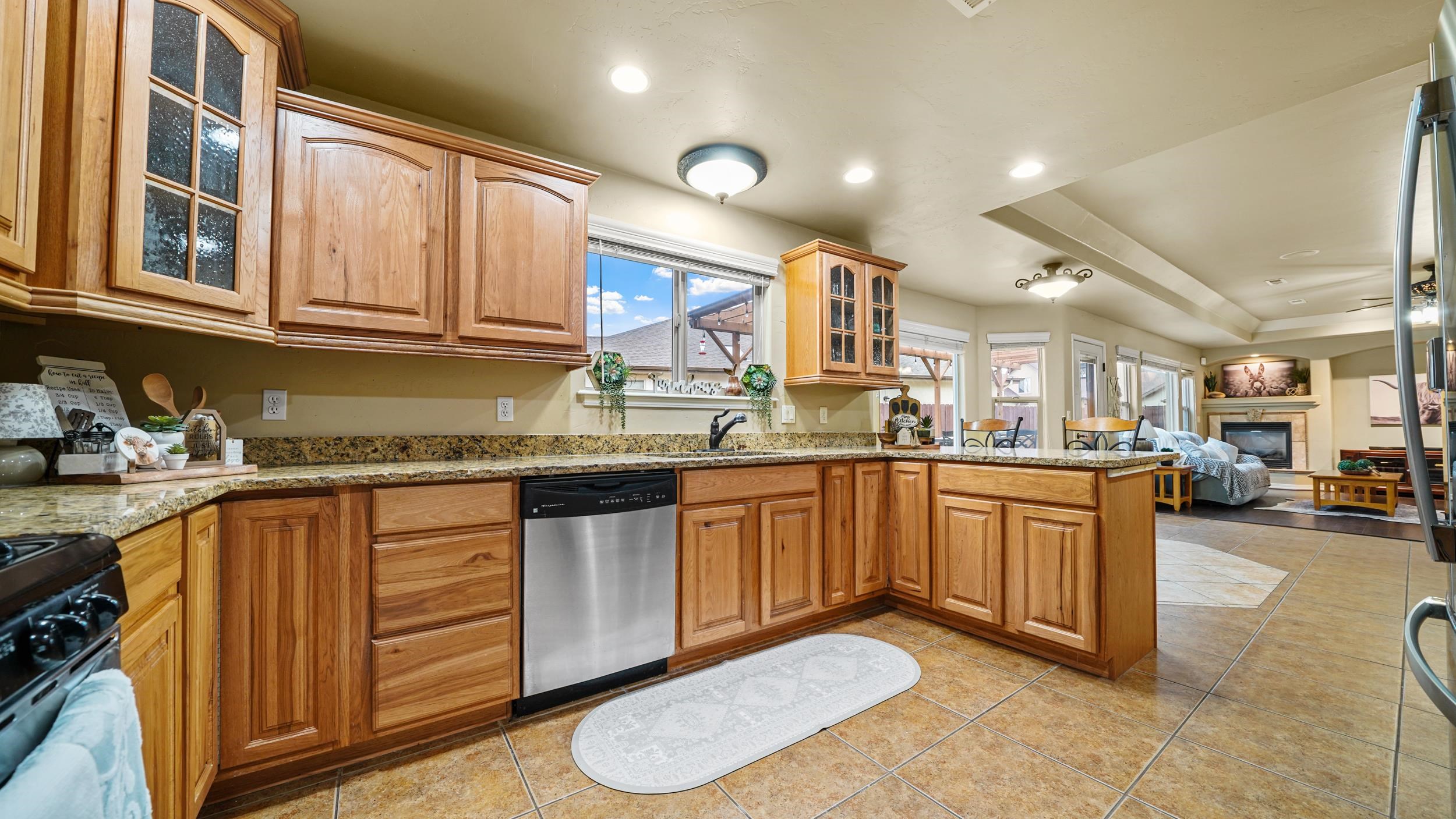 791 Yew Street Fruita, CO 81521 - Photo 13 of 33 a kitchen with stainless steel appliances granite countertop a sink and cabinets