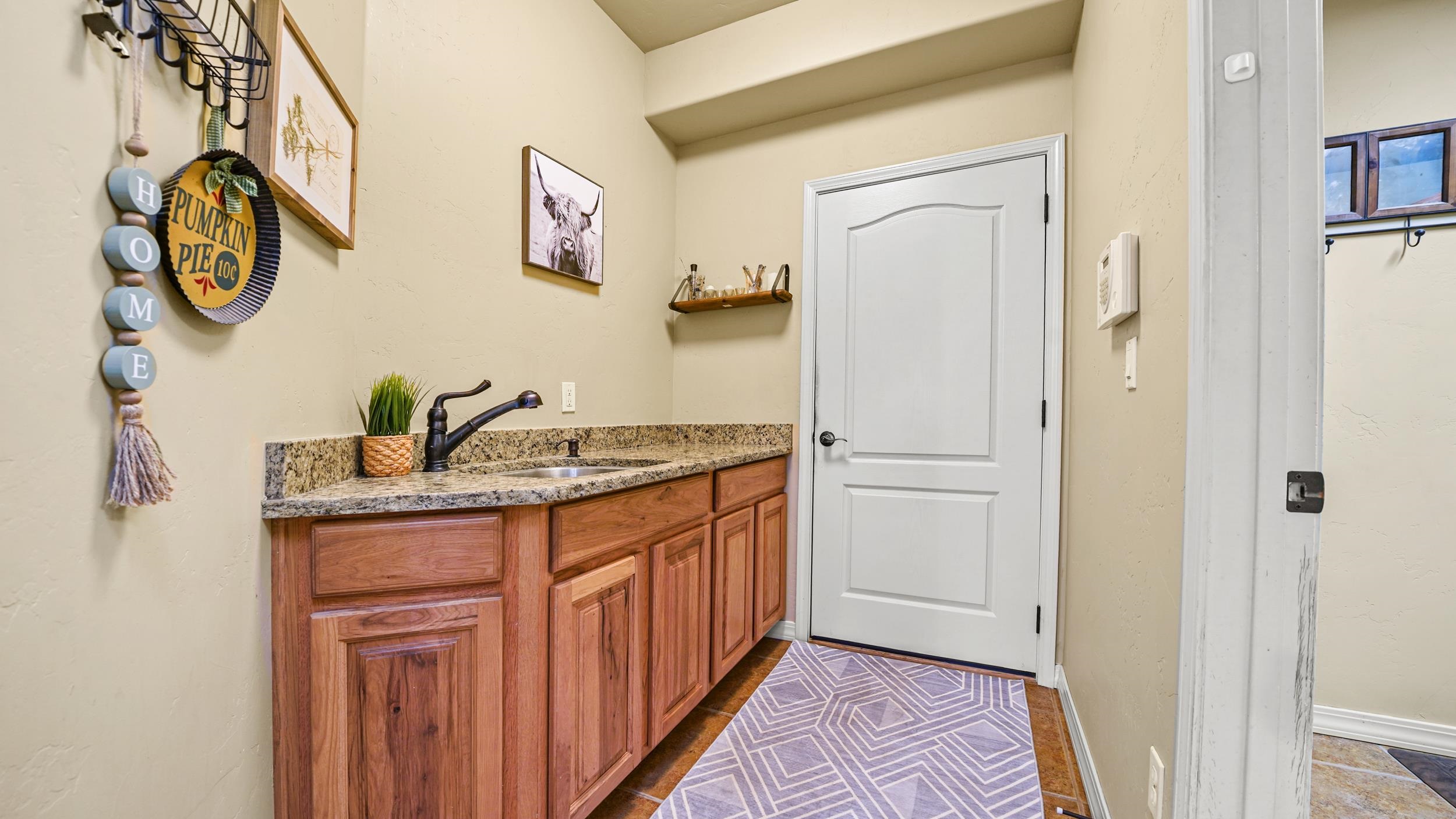 791 Yew Street Fruita, CO 81521 - Photo 14 of 33 a bathroom with a granite countertop double vanity sink and a mirror